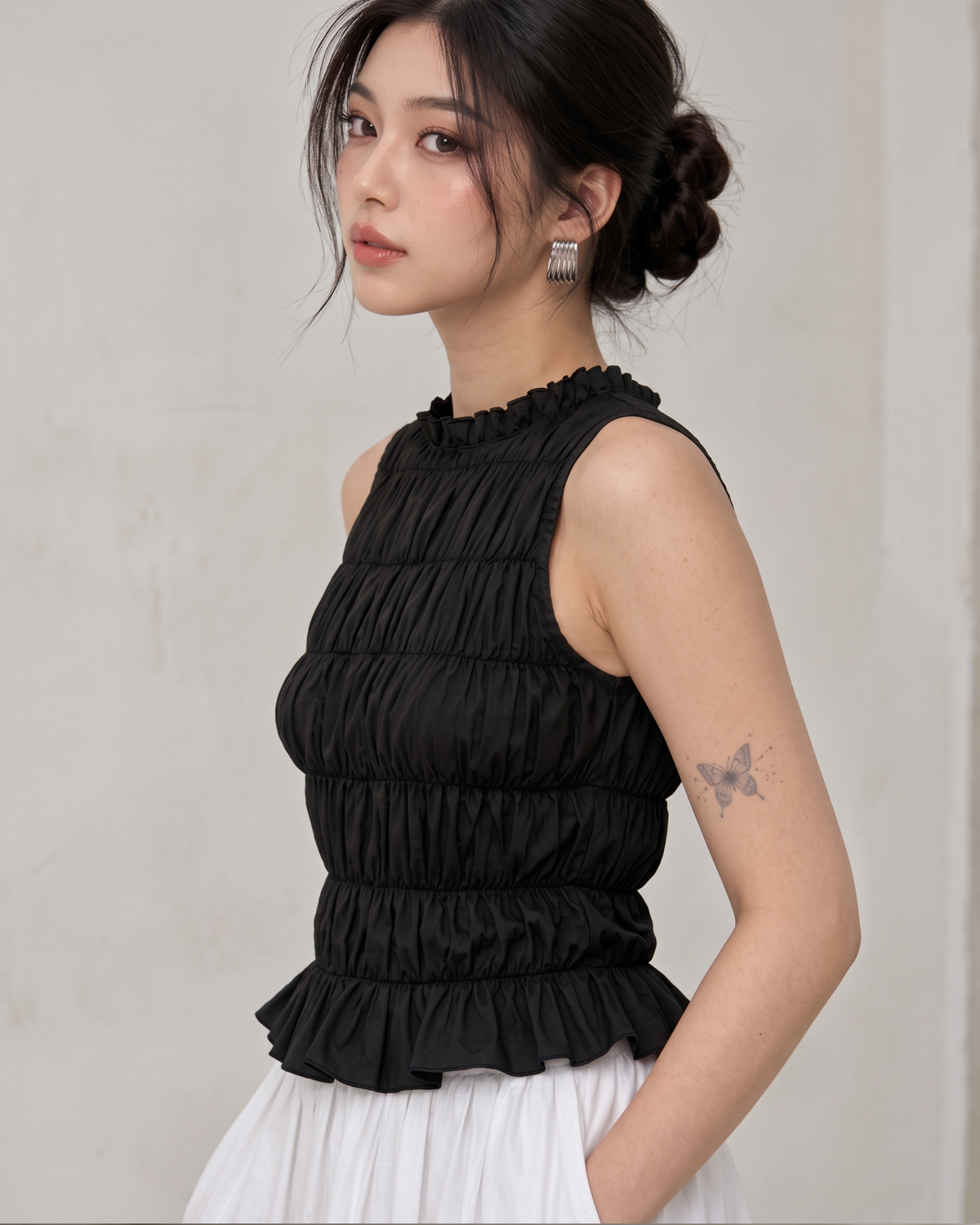 Black Ruffle High-Neck Sleeveless Smocked Peplum Top