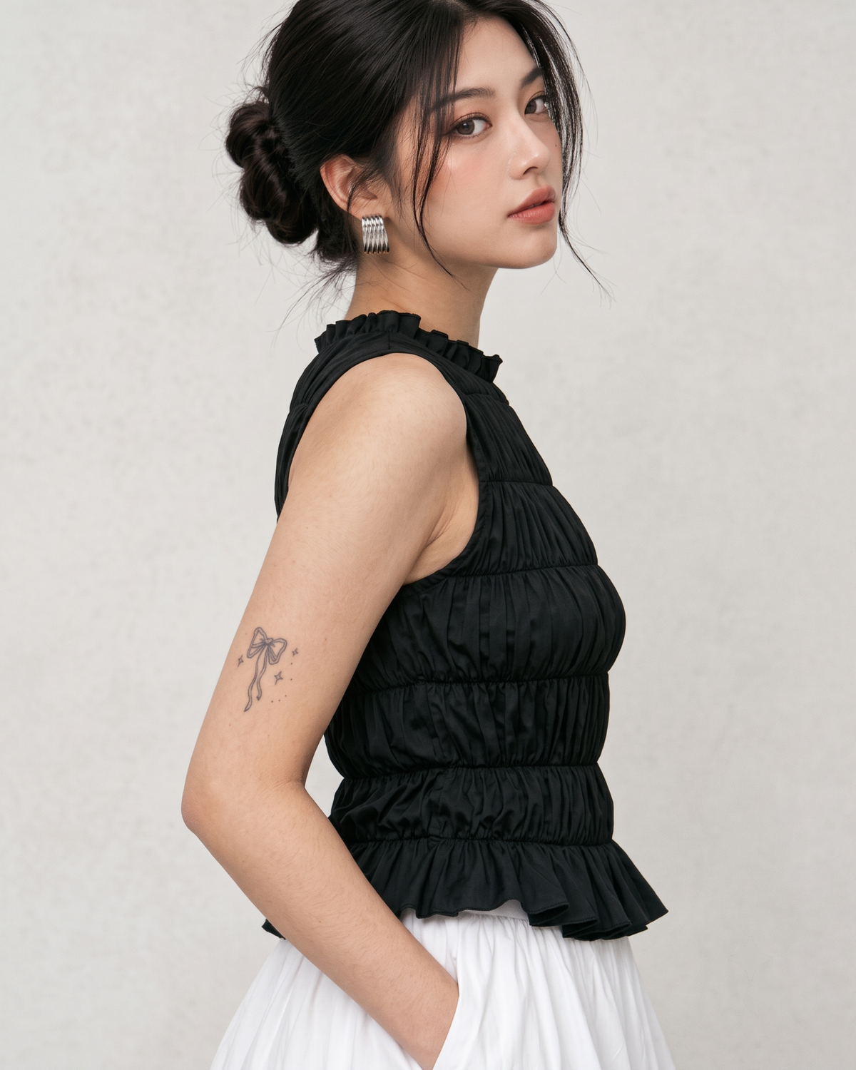 Black Ruffle High-Neck Sleeveless Smocked Peplum Top
