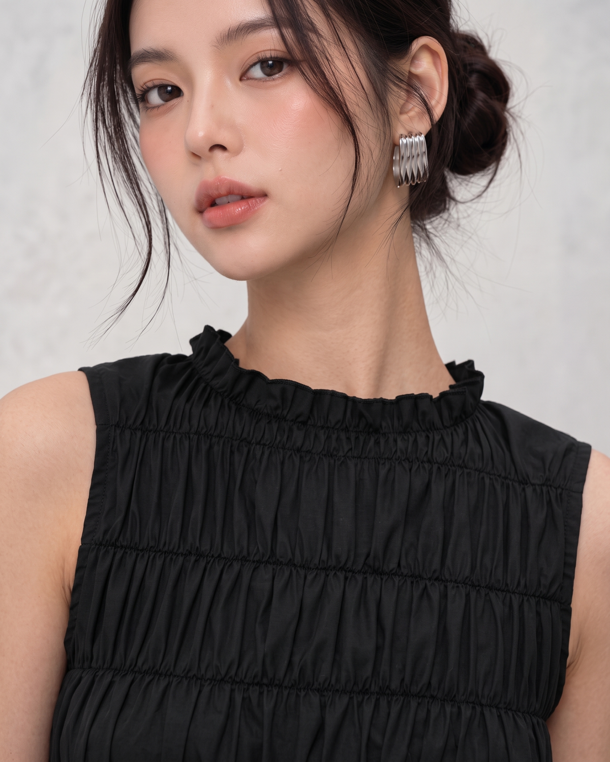 Black Ruffle High-Neck Sleeveless Smocked Peplum Top