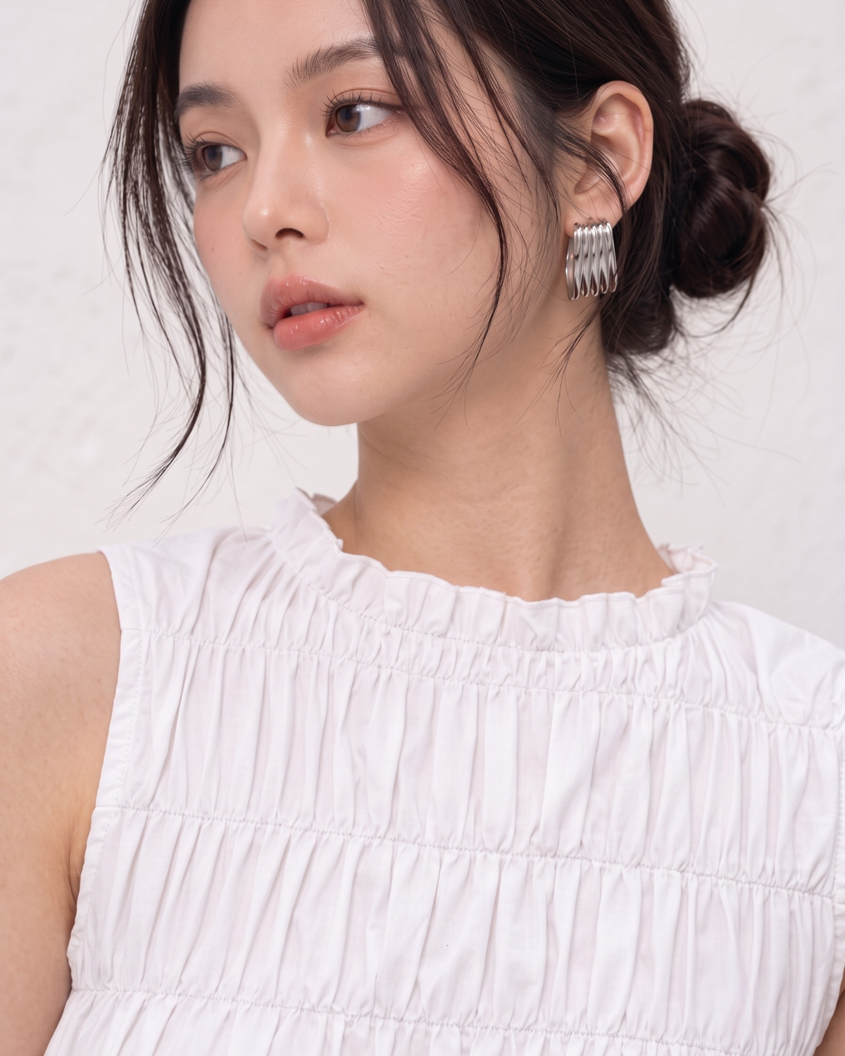 White Ruffle High-Neck Sleeveless Smocked Peplum Top