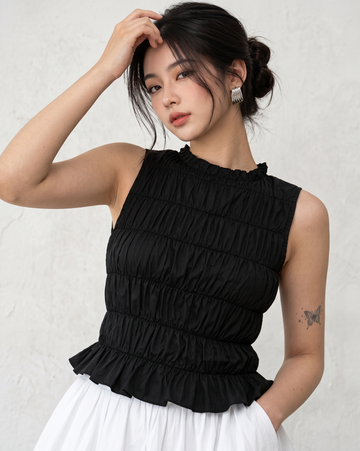 Black Ruffle High-Neck Sleeveless Smocked Peplum Top