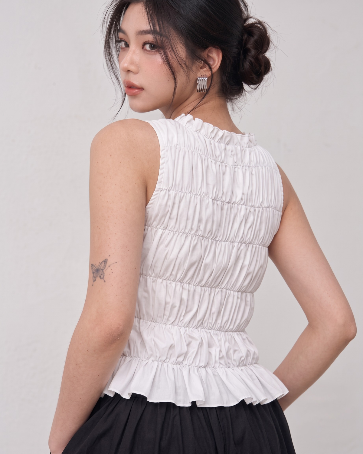 White Ruffle High-Neck Sleeveless Smocked Peplum Top
